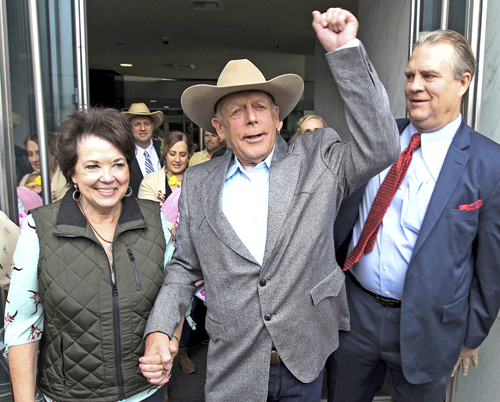 From left, Carol Bundy, rancher Cliven Bundy, his lawyer Bret Whipple, and his son Ammon, in back in hat, leave Las Vegas court after judge ruled government can’t retry Cliven, Ammon and Ryan Bundy, as well as supporter Ryan Payne, because of prosecutors’ deliberate misconduct.