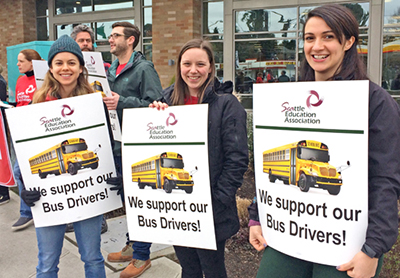 Seattle Education Association members picket Feb. 7 in support of Teamsters school bus drivers who struck First Student bosses. Nine-day strike led to gains in health care coverage, pensions.
