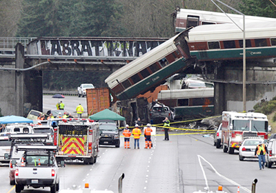 Amtrak train on first trip on new tracks spills onto highway in DuPont, Washington, after derailment Dec. 18. Bosses rushed to put crews on new bypass without adequate training.