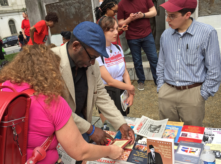 Malcolm Jarrett, center, and Sergio Zambrana, right, joined May 16 mass rally in Raleigh, North Carolina, building teachers’ fight and introducing workers to the Socialist Workers Party. Actions spiked interest in the Militant, books by party leaders and Militant Fighting Fund.