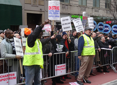 Hundreds of workers rally March 28 in New York to back Spectrum cable workers, members of International Brotherhood of Electrical Workers, on strike for a year against concessions.