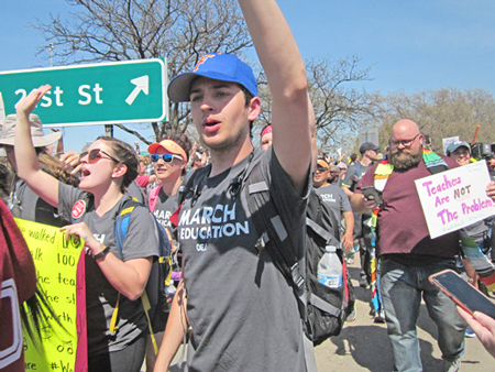 Striking teachers and supporters at end of 110-mile march from Tulsa to Capitol in Oklahoma City join thousands of others demanding action from state legislature April 10.