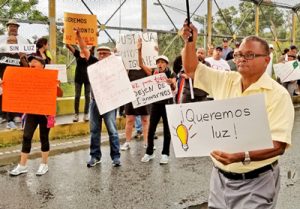 April 30 protest in Humacao. Second sign from the left says, “Being old is not a crime. Enough already of the lies and deceit.” The sign next to it reads, “Lights for everyone, stop ignoring us.”