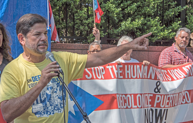 It was working people, not the government who cleared roads, fixed schools after hurricane, Rafael Feliciano, Federation of Puerto Rican Teachers, told June 2 protest in front of U.N.