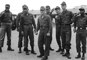 Washington was shaken by spread of mass opposition to Vietnam War “not just among students and millions of workers but increasingly the ranks of the U.S. draftee army,” says Waters. Above, Fort Jackson Eight, GIs who fought effort to court martial them in 1969 for speaking out against the war. Right, Vietnamese liberation fighters, April 1975, celebrate atop captured U.S. tank after victory over decades-long U.S. imperialist intervention.