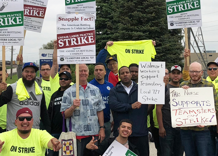 Chicago Teamsters on strike against American Bottling Company on picket line in Northlake, Illinois, May 22, joined by Walmart and other workers, bringing solidarity with union fight.