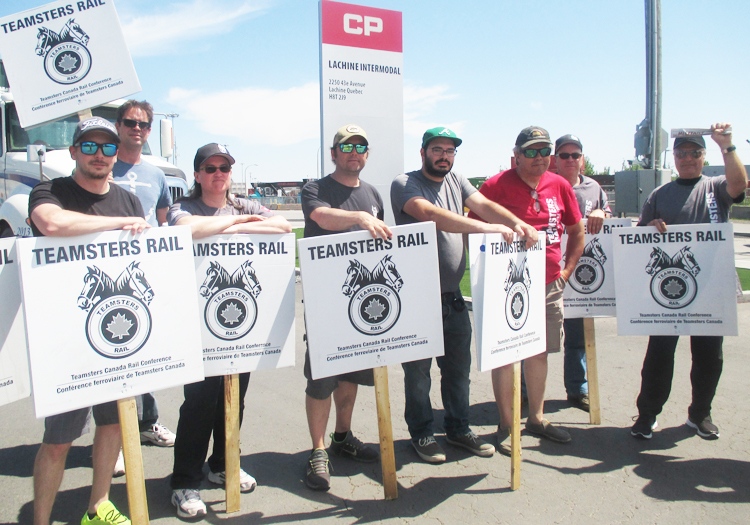 Striking rail workers at Canadian Pacific Intermodal Yard, Lachine, Montreal, May 30. Action by conductors and engineers shut down CP, delayed freight movement around North America.