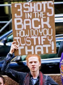 Participant in June 26 march in Pittsburgh protesting cop killing seven days earlier of unarmed teen Antwon Rose. 