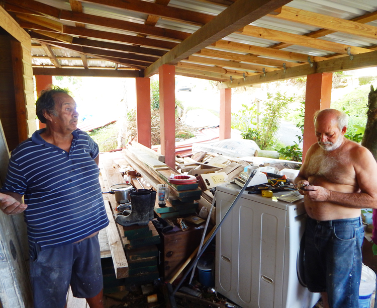 Retired electrical worker Raúl Laboy, left, and Wilfredo Abreu, in Humacao, Puerto Rico, talk to Militant reporters. “Social hurricane” of capitalism is worse than natural one, Laboy said.