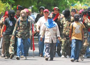 Pro-Ortega gang with mortars and other weapons prepares to attack anti-government protest in Managua April 21. Repression has deepened working-class opposition to the government.