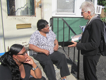 “My campaign supports the Albany Medical Center nurses fighting for their first contract and union miners and Teamsters protesting pension cuts,” Margaret Trowe, standing, SWP candidate for U.S. Senate from New York, told Christine Buckhanon, center, a retired state worker, and her neighbor in Albany July 28. Trowe said workers need to build the labor movement.