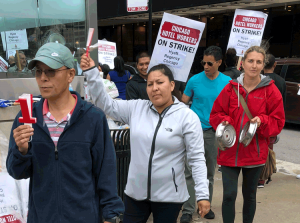 Hotel workers on strike in Chicago picket Hyatt Regency Sept. 7. “We need health insurance no matter what our hours were the previous months,” waitress Rafaela Sandoval told the Militant.