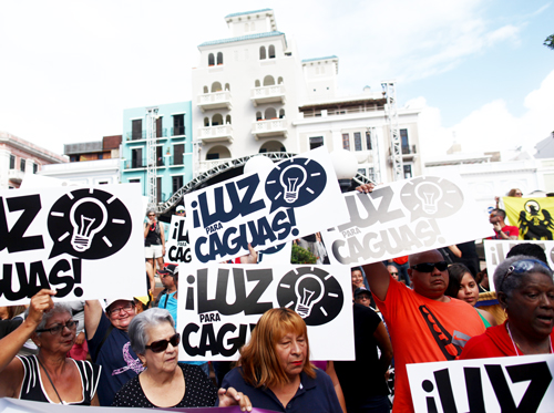 Residents of Caguas protest in San Juan, Jan. 15, demanding return of power four months after Hurricane Maria. Thousands joined protests in face of slow pace restoring electricity as well as against closing of schools. “Many had never joined a protest before,” said Wency Bonilla.