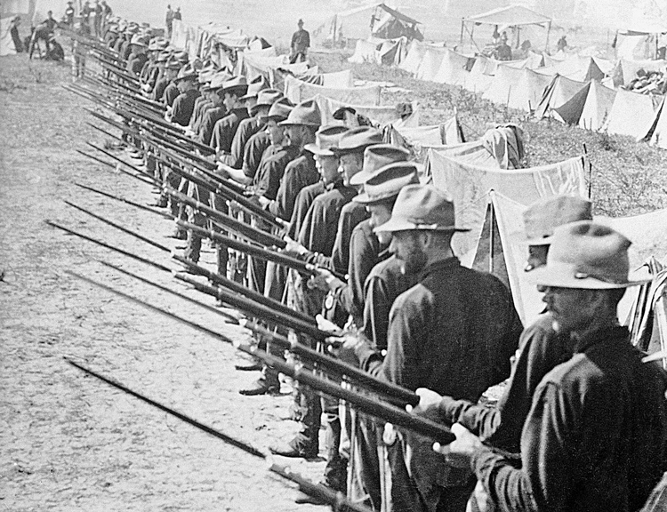 In 1898 Washington seized Cuba, Puerto Rico, Philippines and Guam from Spanish rulers, becoming the victor in world’s first imperialist war. Above, U.S. invasion force with bayonets drawn are ready to defend their camp in Puerto Rico, which remains a U.S. colony to this day.
