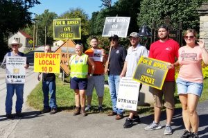 United Food and Commercial Workers members picket at Four Roses distillery Sept. 14. During two-week strike unionists won solidarity, pushed back company’s divisive two-tier plan.