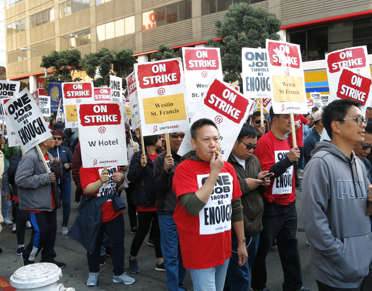 Some 1,000 members of UNITE HERE on strike against Marriott hotels and supporters march in San Francisco Oct. 20 demanding guaranteed hours, affordable health care and higher pay.