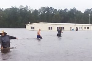Farmworkers at Riggs Brothers Farm in Kinston, North Carolina, called 911 Sept. 15 to ask for help when they woke up in water waist deep. Owner called authorities, said everything was fine, emergency officials cancelled rescue. It was hours before anyone came to get them out.