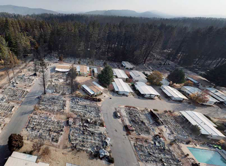 Drone photo of damage near Paradise, California, where Camp Fire ravaged region. It broke out under PG&E high voltage lines shortly after company reported wire problems there.
