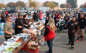 Impalas Car Club members serve meal to fire survivors in Walmart lot, Chico, California, Nov. 17. In face of government neglect, working-class solidarity key to get food, clothes, supplies.
