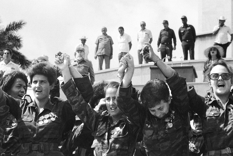 Members of Cuban women’s antiaircraft artillery unit, May 1989, after return from Angola following defeat of South African invasion. “Cuban volunteers on internationalist missions,” said Zayas, “are learning about capitalism, about the exploitation of man by man.”