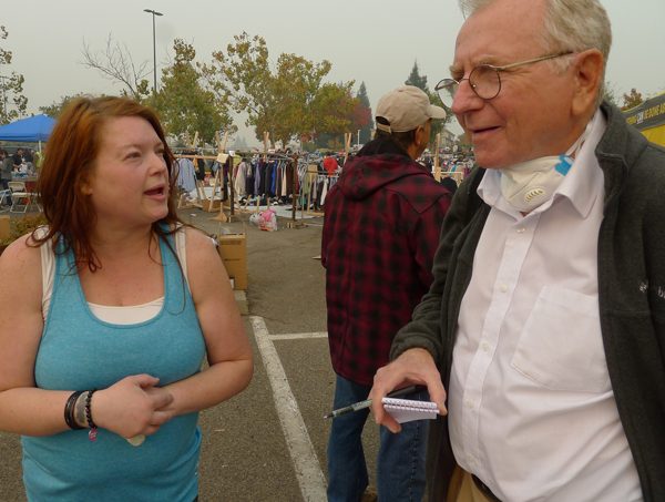 Socialist Workers Party member Jeff Powers talks with fire survivor Denise Chester Nov. 15 at Chico Walmart parking lot camp.