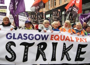 During two-day strike for equal pay, local council workers in Glasgow, Scotland, mostly women, win support of fellow trade unionists Oct. 23. Male co-workers wouldn’t cross picket lines.