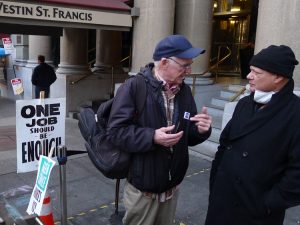 Socialist Workers Party member Joel Britton, left, speaks with Marriott hotel striker and UNITE HERE member Carlos Zevallos at Westin St. Francis hotel in San Francisco Nov. 18. Zevallos got a Militant subscription. “Without the union,” he said, “I might be one of the homeless.”