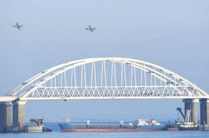 Russian fighter jets fly over Kerch bridge with Russian tanker blocking access to Sea of Azov during assault on, seizure of three Ukrainian naval boats and their 24 crew members Nov. 25.