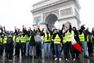 Protesters at Arc de Triomphe in Paris Dec. 1, before cop tear gas and water cannon attack.
