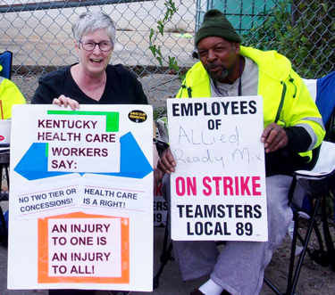 Amy Husk, SWP candidate for Kentucky governor, helps build solidarity with workers under attack. Above, she joined workers on strike on Allied Ready Mix picket in Louisville Oct. 19