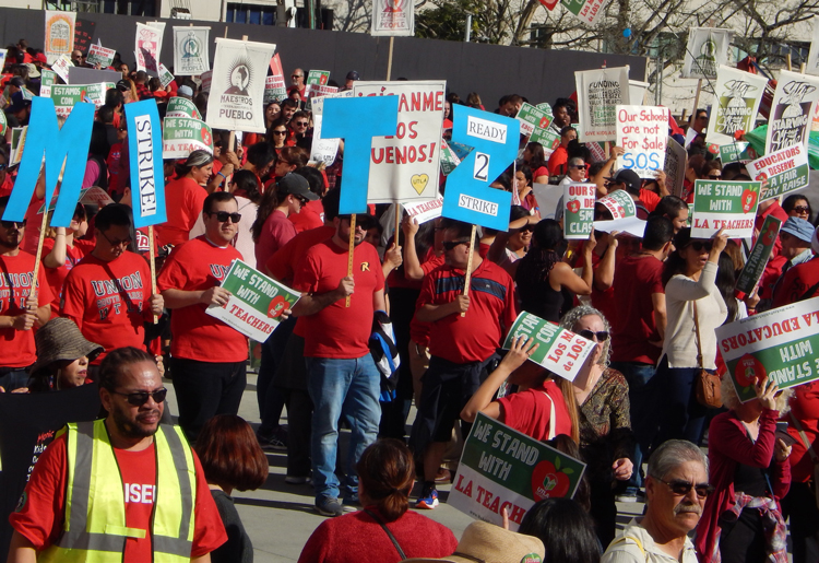 Teachers marched Dec. 15 demanding more funds for schools, smaller classes, higher pay.