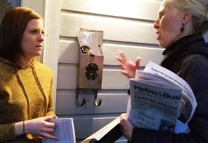“I’m probably a socialist, too,” Katelyn Galbreath told Socialist Workers Party campaigner Sarah Ullman, right, after they talked when Ullman knocked on her door in East Dallas, Jan 17.
