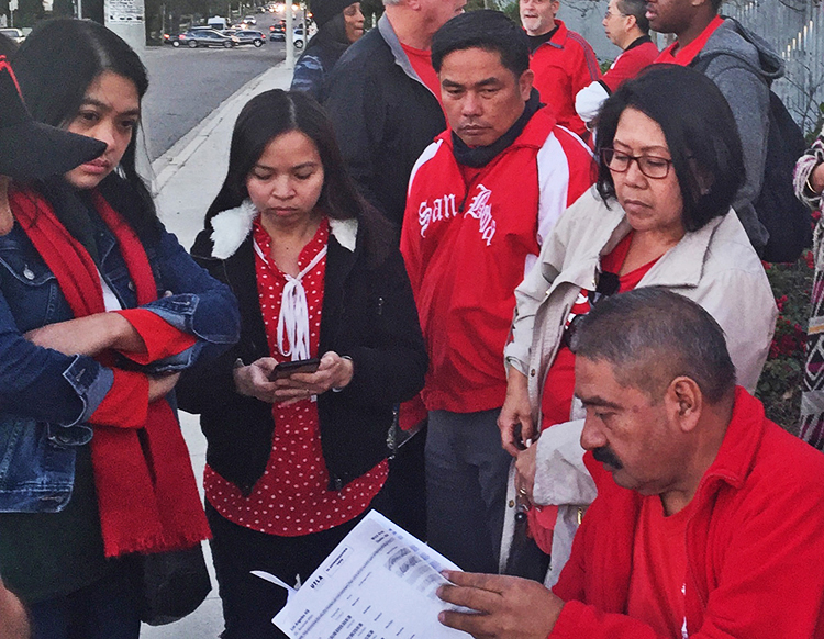 Teachers in Los Angeles review proposed contract before vote after six-days on strike Jan. 22.