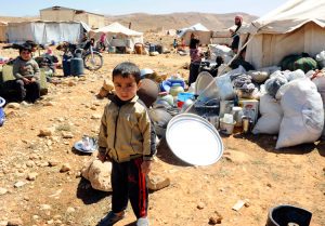 Syrian child in refugee camp, in Lebanon, 2014. Yearslong war grew out of Syrian dictatorship’s brutal assault on popular rebellion, and interventions by Washington, Tehran, Moscow and other capitalist powers, leading to over 400,000 killed and millions driven from their homes.