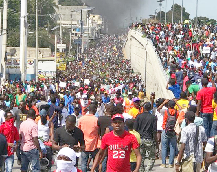 Haitian working people gather in Port-au-Prince Feb. 7 demanding President Jovenel Moise resign. Protests were triggered by soaring inflation, youth joblessness and rampant corruption.