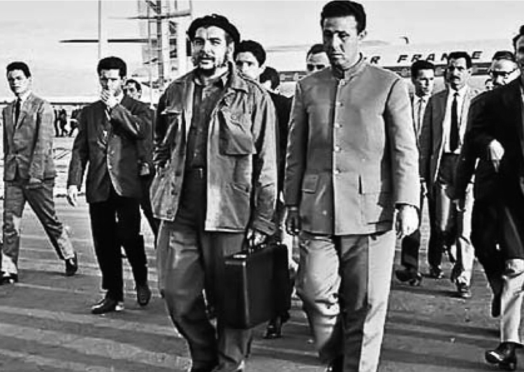 Ernesto Che Guevara with Algerian President Ahmed Ben Bella, right, at Algiers airport, April 1964. Ben Bella government collaborated with Guevara and other Cuban leaders to aid national liberation struggles in Africa.