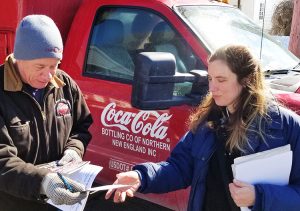 Truck driver Bill Scholl gets subscription to the Militant from Samantha Hamlin, Socialist Workers Party candidate for mayor of Troy, in his driveway in Waterford, New York, March 9.