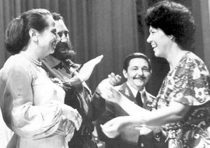 Asela de los Santos, right, receiving award in 1974 from Vilma Espín, both of whom had been leaders of the Federation of Cuban Women. Also present are Fidel Castro and Raúl Castro.