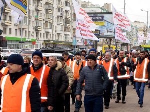 Members of Free Trade Union of Railway Workers of Ukraine and union supporters march in Kiev March 19 for wage increase, pensions, medical care and protection against layoffs.