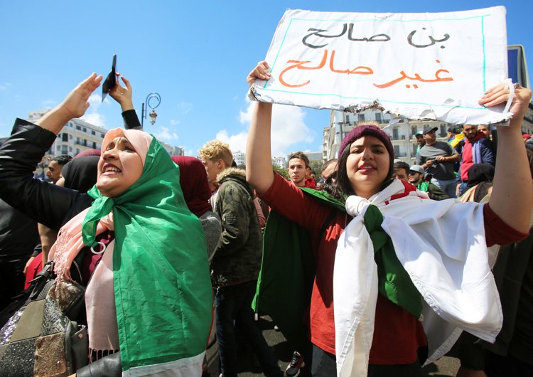 Protesters in Algiers April 9 demand removal of entire government after Algerian President Abdelaziz Bouteflika was replaced by Abdelkader Bensalah. Placard reads, “Bensalah, not fit.”