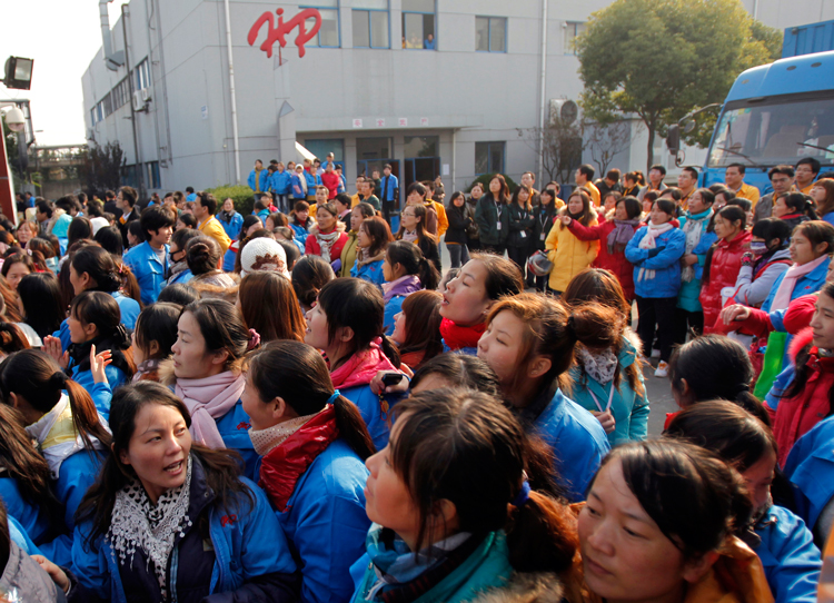 Workers block Hi-P company gates in Shanghai, 2011, after bosses announced layoffs. Rapid capitalist growth in China has created big industrial working class with great political potential.