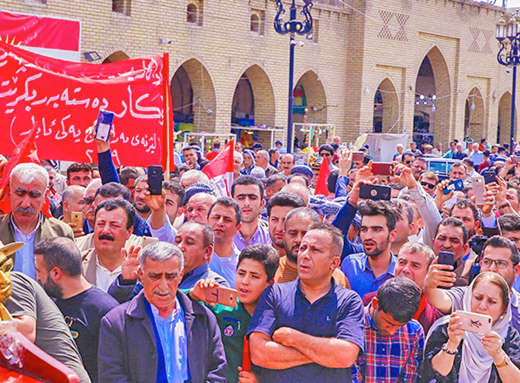 May Day march in Erbil, Kurdistan. Banner demands the government provide jobs. Other banners demanded, “Kurdistan Regional Government must recognize workers’ rights in law!”  