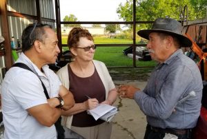 Alyson Kennedy, Socialist Workers Party candidate for mayor of Dallas, and campaign supporter Gerardo Sánchez, left, talk to construction worker Everardo Guerrero in Venus, Texas, May 8. He and his daughter got a subscription to the Militant, two books on special and made donation to Militant Fighting Fund.