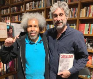 Albert Woodfox, left, with Books and Books owner Mitchell Kaplan May 16. Almost 100 people jammed into Miami bookstore to hear Woodfox speak on his book Solitary: My Story of Transformation and Hope. Florida prison censors have tried to block the Militant from reaching inmates with his story, claiming it will “lead to the use of physical violence.”