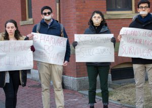 Students protest Feb. 11 for removal of African American Harvard law professor Ronald Sullivan as dean of Winthrop House. He was targeted for providing legal counsel to movie producer Harvey Weinstein. Inset, graffiti on college door.