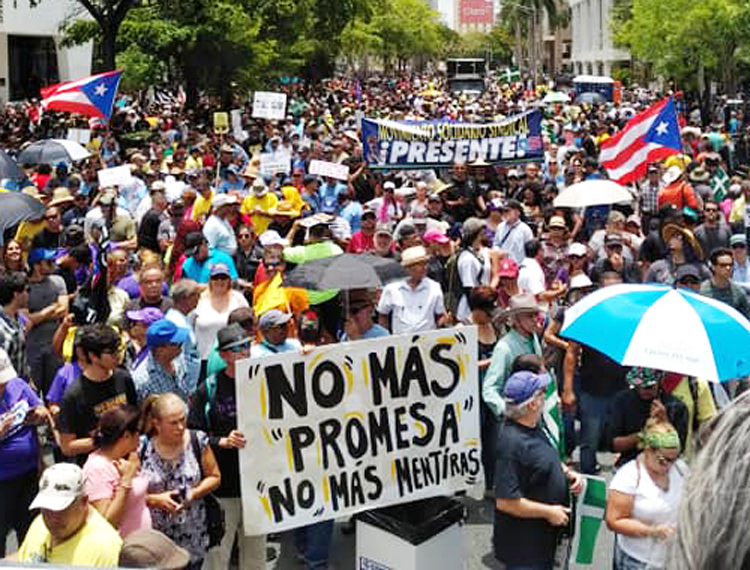 May 1 union protest in San Juan, Puerto Rico. Front placard says, “No more Promesa” — the U.S.-imposed law demanding Puerto Rico pay its foreign debt — and “No more lies.”