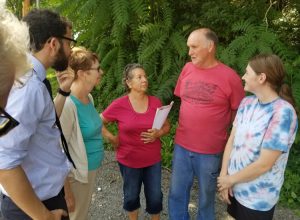 From left, Samir Hazboun, SWP candidate for Kentucky lieutenant governor, and Alyson Kennedy, SWP presidential candidate in 2016 and former coal miner, talk with Lita Melton, retired union miner James Melton, and farmer Jessica Ison at Whitesburg farmers market July 13.