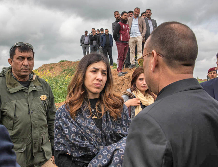 Nadia Murad, center, who escaped from Islamic State captivity, in discussion at event marking opening of first mass grave of Yazidis in Kocho. Hundreds of thousands of Yazidis remain displaced. 