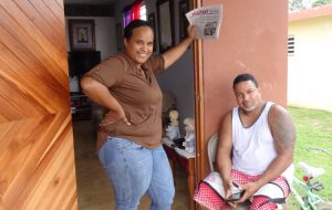 Top, unrepaired home in Yabucoa two years after Hurricane Maria. “What did government do with millions in aid?” said fisherman Julio Morales. Below, Karelys Velázquez and neighbor Nelson Martínez in Punta Santiago discuss common challenges facing workers in U.S. and Puerto Rico with SWP delegation.