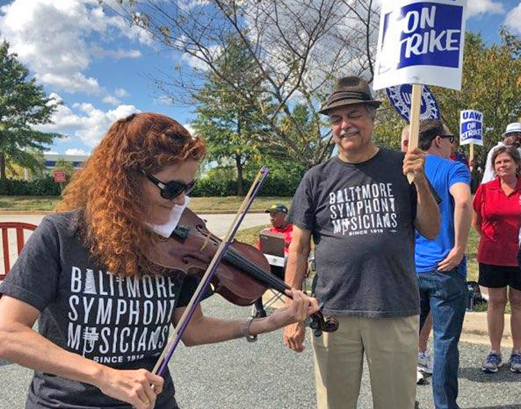 Baltimore Symphony musicians, who were locked out for over three months, joined United Auto Workers strike picket line at GM’s transmission plant in White Marsh, Maryland, Sept. 18.